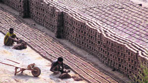 Despite a ban on child labour, these children work at a brick-kiln at Akhnoor Road in Jammu to earn livelihood.