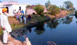 for everyone to see: Residents of Gazipur village show the highly toxic water flowing in the Kala Sanghian drain.