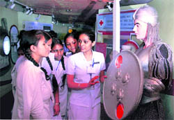 An instructor explains to students various points relating to HIV/AIDS and