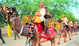 BSF soldiers ride camels after being flagged off for the Seema Prahari Camel Safari at Munabao, Rajasthan, on Saturday. The soldiers are on a mission to develop rapport with the civilian population in border areas