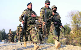 Afghan soldiers arrive at the scene of a gunbattle near Jalalabad airport on Saturday.