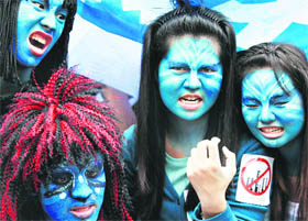 Taiwanese do makeup like Navi clan to voice their opposition against government policy for petrochem industry in Taipei on Saturday.