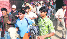 Candidates come out of one of the centres after appearing in the exam for the post of constable in Chandigarh on Sunday. 