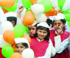 Schoolchildren with tricolour balloons at the inauguration of the 30th India International Trade Fair (IITF) at Pragati Maidan in New Delhi