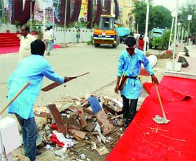 Labourers clean the venue