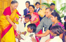  Uttarakhand Governor Margaret Alva gives away gifts to poor students. 