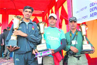 Winners with trophies in Palampur.