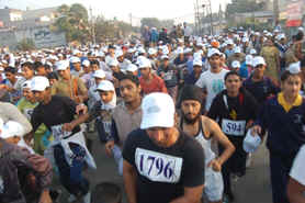 Students take part in the half marathon in Kapurthala on Sunday.
