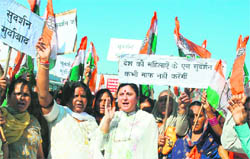 Workers of the Mahila Congress protest against former RSS chief KS Sudarshans remarks against Congress President Sonia Gandhi in Jammu on Sunday