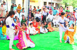 Students of Government Girls High School, Resham Ghar Colony, celebrate the day