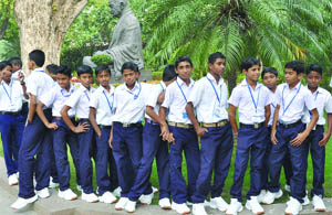 Schoolchildren from Lakshdweep stand outside Parliament in New Delhi, after the Opposition disrupted the proceedings in the Lok Sabha on Monday.