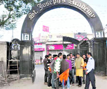Volunteers force the closure of St Joseph Academy in Dehradun on Monday.