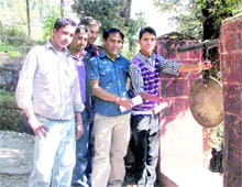 Activists of the ABVP and the BJYM sound a bell at Ghanand School in Mussoorie as part of a call for closure of schools and colleges