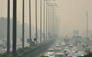 Vehicles move amid dense smog on the Delhi-Jaipur National Highway in Gurgaon on Monday.