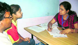 A psychologist counsels a child and his parent at a camp organised by Big FM in Hisar.