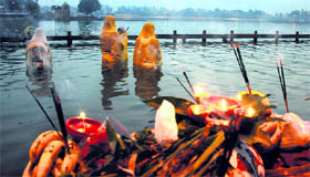 Devotees perform rituals on the occasion of Chhath Puja on the banks of the Brahma Sarovar in Kurukshetra.