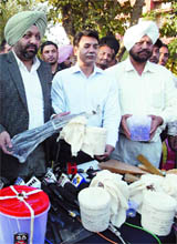 SSOC officials display an AK-47 and 5 kg heroin before the media in Amritsar on Monday