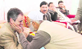 Chief Minister Omar Abdullah interacts with a resident in Kupwara on Monday.