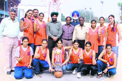 The winners of the 20th Annual Basketball League with their trophy at Gure village in Ludhiana. 