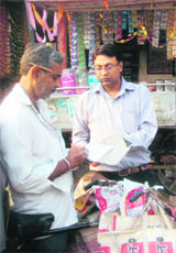 Officials of the tobacco control cell constituted by the Patiala Civil Surgeon office issue challan for violating of the Tobacco Control Act to a vendor.