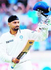 SINGH IS KING: Harbhajan Singh celebrates after completing his century in Hyderabad