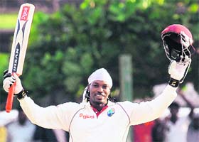 West Indies batsman Chris Gayle celebrates after scoring a double century during the first day of the first Test match against Sri Lanka in Galle