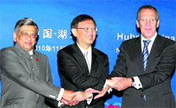 External Affairs Minister SM Krishna poses for a photograph with his Chinese and Russian counterparts Yang Jiechi (centre) and Sergei Lavrov during the RIC trilateral meeting in Wuhan on Sunday