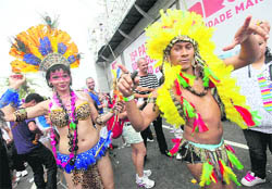 Participants dance at the annual gay pride parade in Rio de Janeiro on Sunday