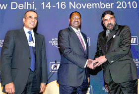 Commerce and Industry Minister Anand Sharma (R) shakes hands with Kenyan Prime Minister Raila Amolo Odinga, as Sunil Bharti Mittal, Chairman and Group Chief Executive Officer of Bharti Enterprises, looks on during the India Economic Summit, organised by the World Economic Forum in partnership with Indian industry chamber CII, in New Delhi on Tuesday.