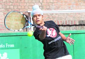 A player in action during a tennis match at the CLTA, Sector 10, Chandigarh