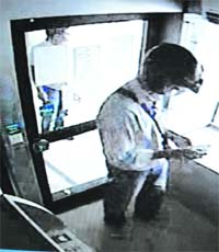 A CCTV footage of the suspect withdrawing cash from an ATM of the State Bank of Patiala branch in Sector 4, Panchkula
