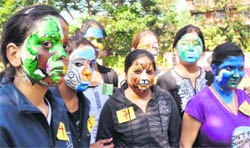 Students of Sardar Bhagwan Singh Biomedical Institute participate in a face-painting competition during the annual day function in Dehradun 