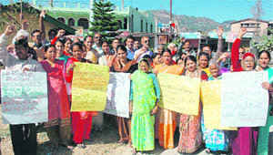 Residents of Pitthoragarh protest poor water supply in the town on Monday.