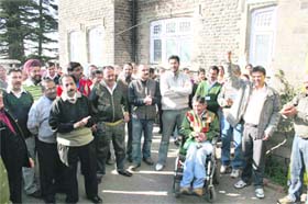 Employees of the State Bank of India hold a protest against the bank management in front of the branch in Shimla