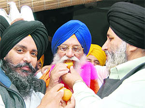 Sweets being offered to Avtar Singh after his election as SGPC president. Tribune photo: Vishal Kumar