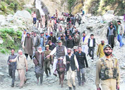 Minister for Higher Education Abdul Gani Malik on the horseback on his way to the remote Shadole village in Reasi district