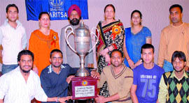 Apeejay College of Fine Arts students pose with the overall trophy in Inter-Zonal Youth Festival of GND University in Jalandhar on Tuesday.