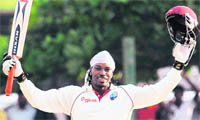 Chris Gayle celebrates after scoring a triple century in Galle
