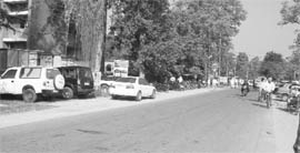 Vehicles parked on both sides of the road near the district courts in Ropar. 