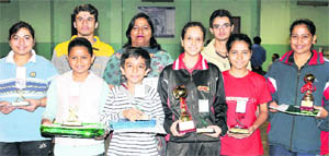 Table tennis winners with their trophies in Sector 23, Chandigarh.