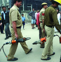 Policemen at the building collapse site at Laxmi Nagar in New Delhi 