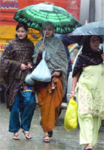 Women caught in the unexpected downpour in New Delhi