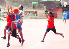 A match of the DDCSA Junior Girls Basketball Tournament under way at Welham Girls School in Dehradun on Wednesday.