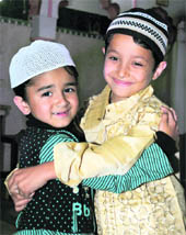 Kids greet each other on the occasion of Eid at a mosque in Dharamsala on Wednesday.