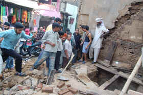 People throng a shop after hearing about a treasure in Namak Mandi in Amritsar on Wednesday.