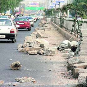 Boulders hinder smooth flow of traffic on the Ferozepur road in the absence of any caution signs