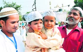 Children greet each other at Idgah on the occasion of Eid-ul-Zuha in Jalandhar