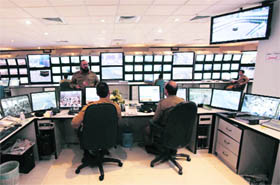 Saudi policemen monitor screens connected to cameras set up at all holy places in Mecca on the second day of the Id al-Adha festival on Wednesday. Millions flock to Mecca in Saudi Arabia for the annual Haj pilgrimage, a duty for every able-bodied Muslim who can afford it