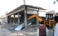 Bathinda Municipal Corporation staff demolish an illegal structure at the Prajapat Colony in Bathinda