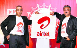 Bharti Airtel Chairman and MD Sunil Bharti (L) and CEO (India and South Asia) Sanjay Kapoor pose with the company's new logo during a press conference to unveil a "new youthful and dynamic global identity" of Bharti Airtel, in New Delhi on Thursday.